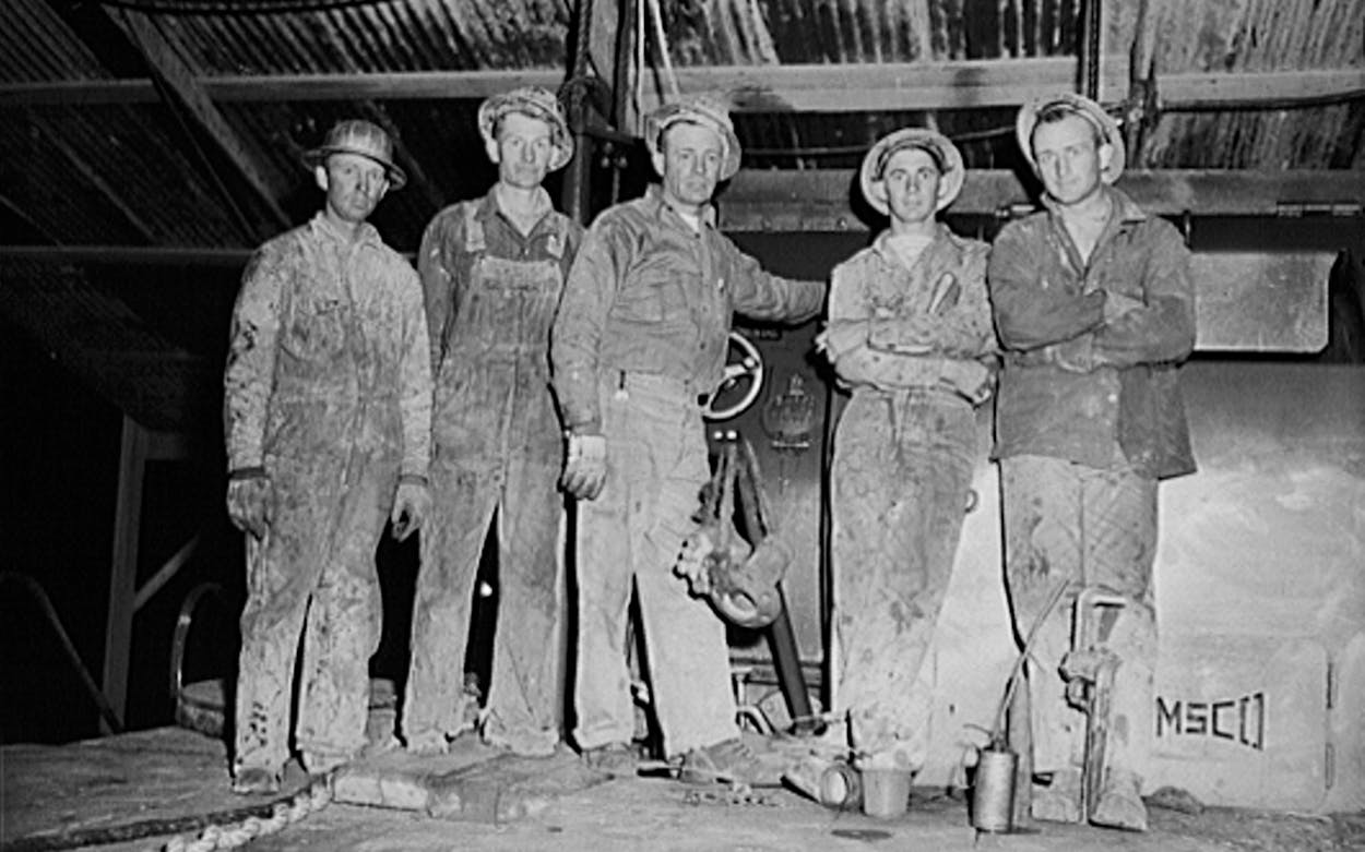 Driller and roughnecks on night tour in Andrews County in November 1942 for boomtown