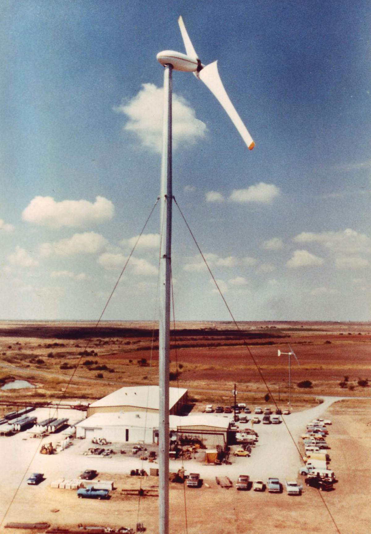 A prototype turbine built by Carter Wind Systems stands over the company's Burkburnett manufacturing plant, circa 1982.