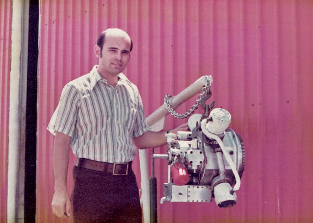 Jay Carter Jr. beside a prototype of his steam engine in Burkburnett in the early seventies.