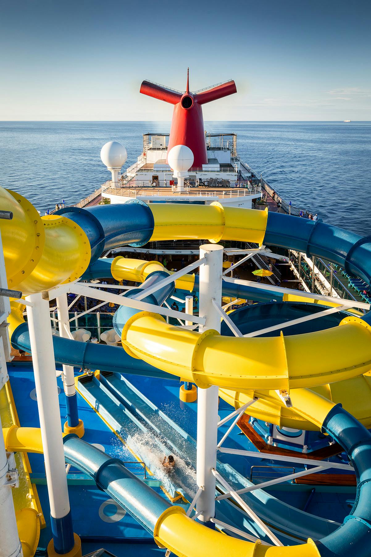 Carnival cruise blue and yellow twisty slide. 