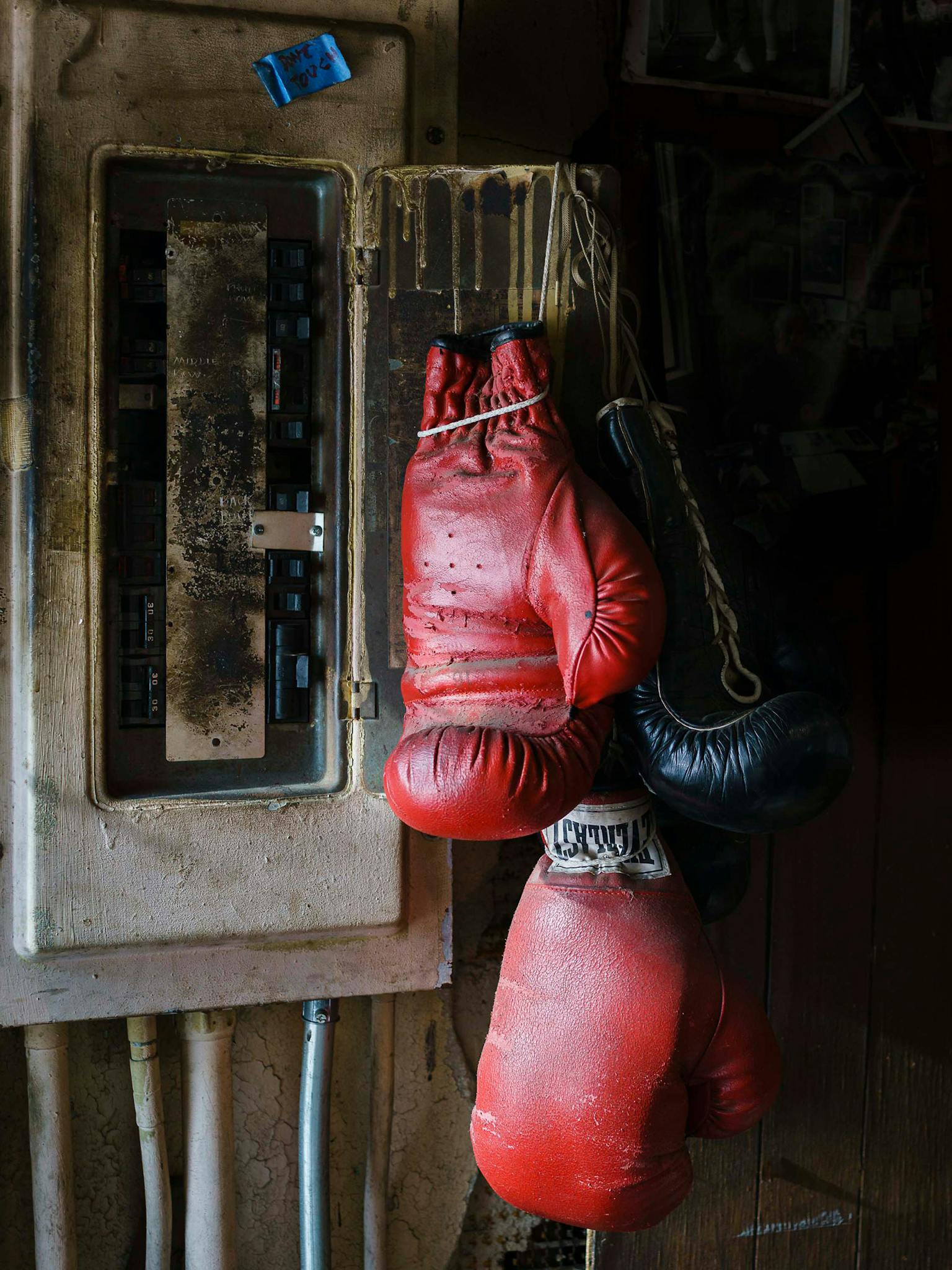 “This is pure Doug,” says Diamond, of the boxing gloves draped lazily over a fuse box that looks ready to short circuit. (The little blue note reads, “Don’t Touch.”) The fuse box clung to the wall of Eidd’s office, and the gloves never left their perch. The leather and metal, the paint drips and pipes, the intense dark shadows and the glint of light on leather give this picture the feel of a still-life painting.