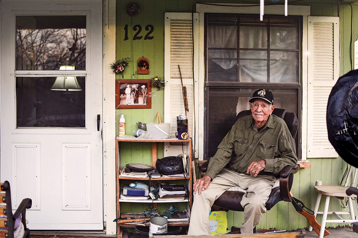 Carlos Peña on his porch in his San Antonio home, 2018