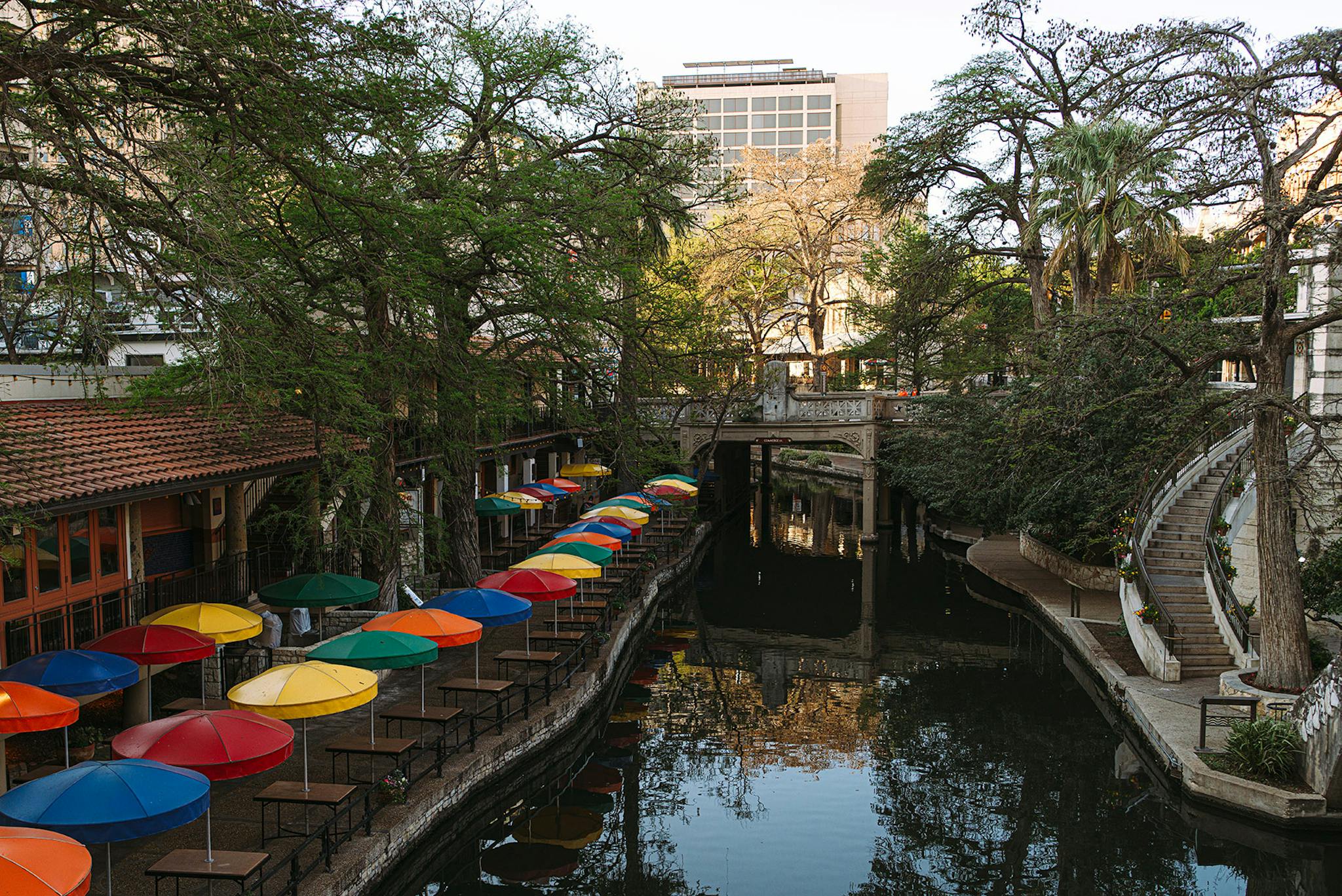 The San Antonio River Walk sits mostly empty, and its waters have begun running unusually clear.