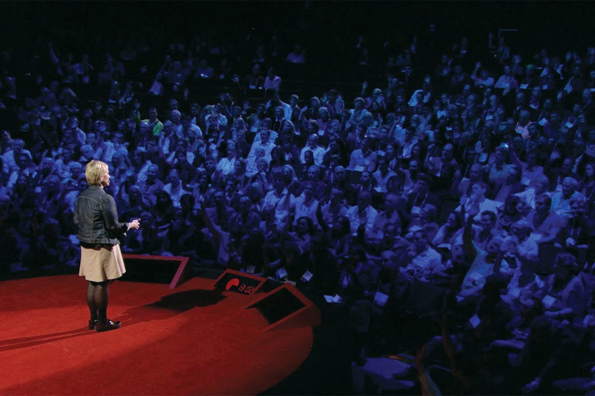 Brown faces the crowd as she gives a TED Talk. 
