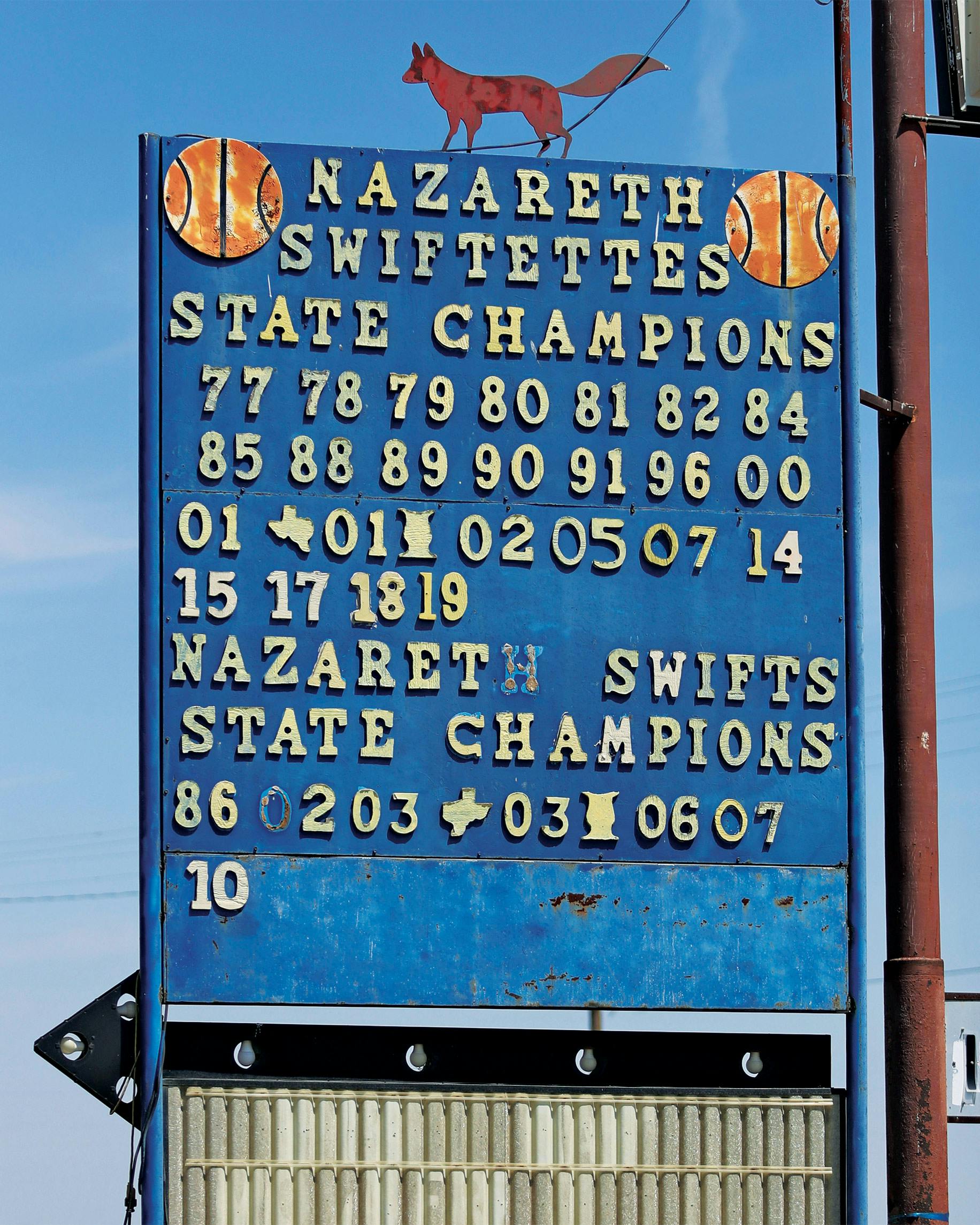 A sign in downtown Nazareth, touting the Swiftettes' and Swifts' state championships.