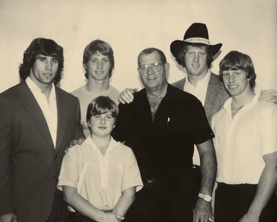 Old black and white photograph of the Von Erich men. 
