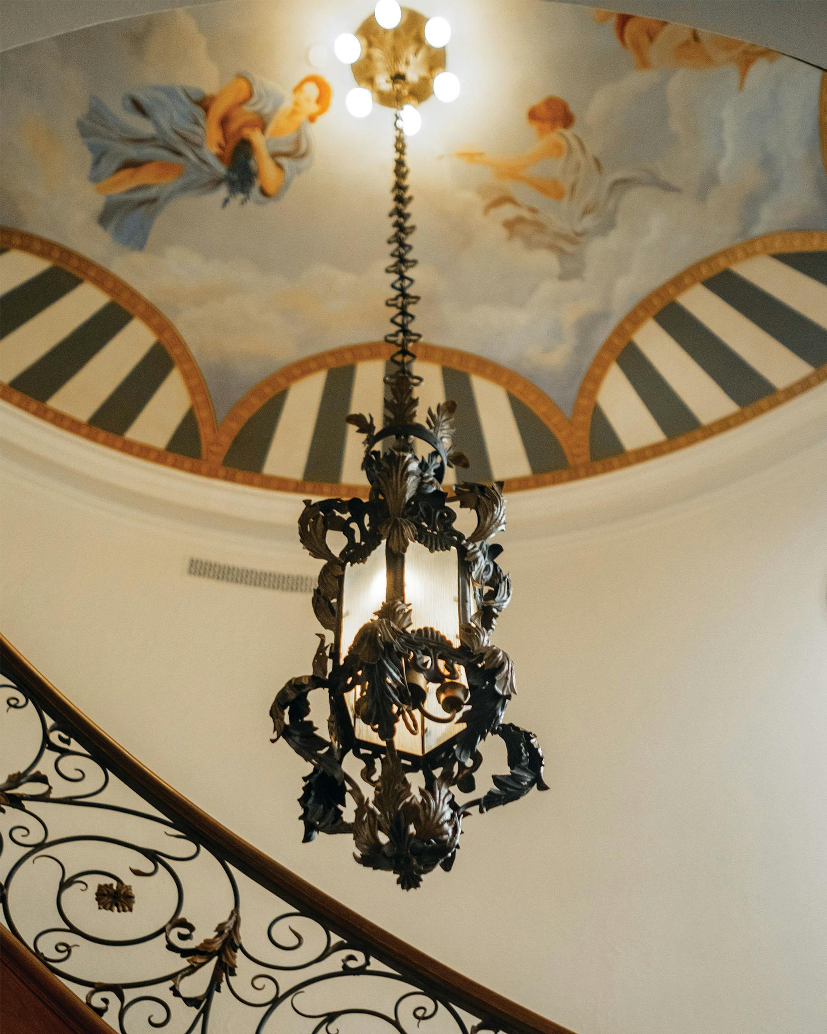 Walking into the Inn, a larger-than-life hand-painted mural depicts a pastoral, bluebonnet-speckled scene that re-creates the experience of looking out on the Hill Country in springtime. In the mansion, though, this mural atop the original spiral staircase is decidedly more ethereal.