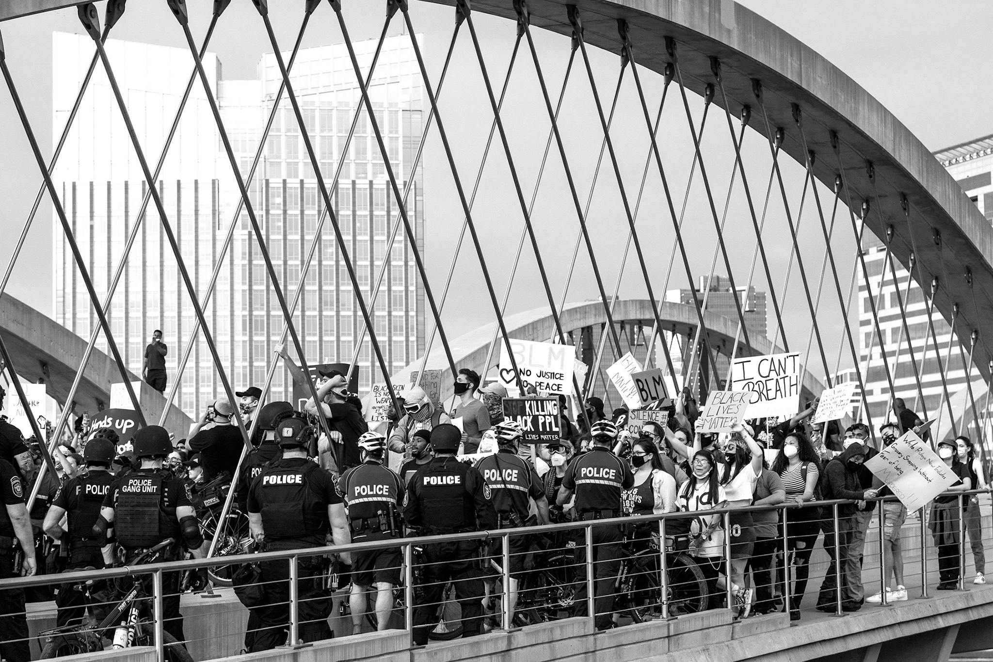 Protesters face the police blockade on the Trinity Bridge in Fort Worth on May 31, 2020.