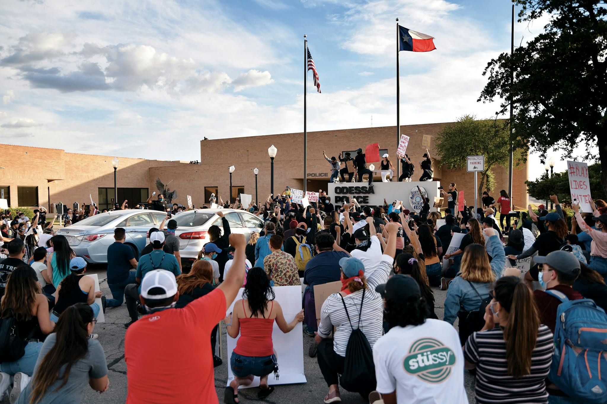 Protesters take a knee outside of the Odessa Police Department during a Black Lives Matter protest in Odessa on May 31, 2020, following the death of George Floyd on May 25.