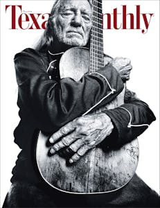 Willie Nelson hugging his guitar on the cover of Texas Monthly. 