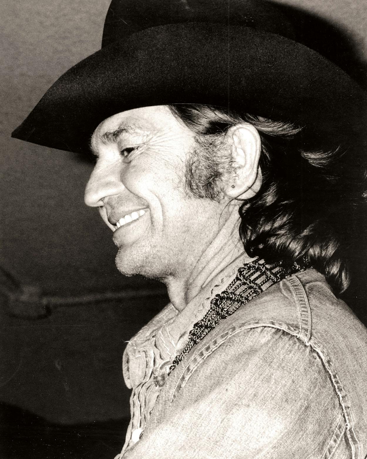 Country singer/songwriter Willie Nelson performs onstage in circa 1974.