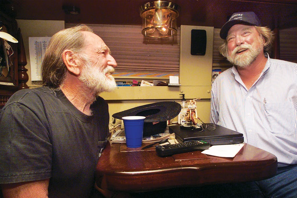 Willie and Roger Allison, a farmer and the director of the Missouri Rural Crisis Center, on Willie’s bus in Columbia, Missouri, on May 12, 2003.
