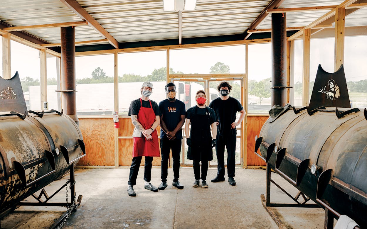 Dylan Taylor, Jalen Heard, Lane Milne, and Jonny White in the pit room of Goldee’s Barbecue, in Fort Worth, on June 26, 2020