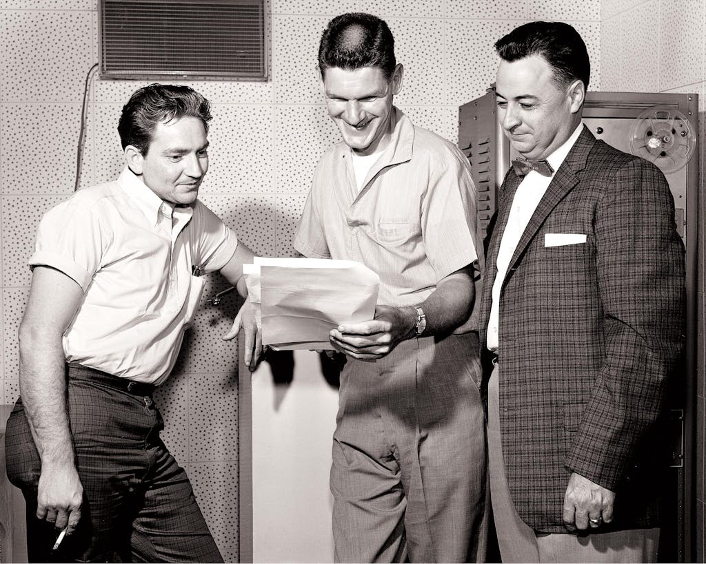 Willie Nelson (left) and fellow songwriter Harlan Howard with their boss Hal Smith, the owner of the Pamper Music publishing company, on July 15, 1961.