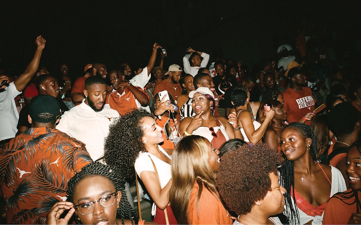 Students and alumni celebrating at the annual Black Homecoming in front of the Tower, at the University of Texas at Austin, in fall 2019.