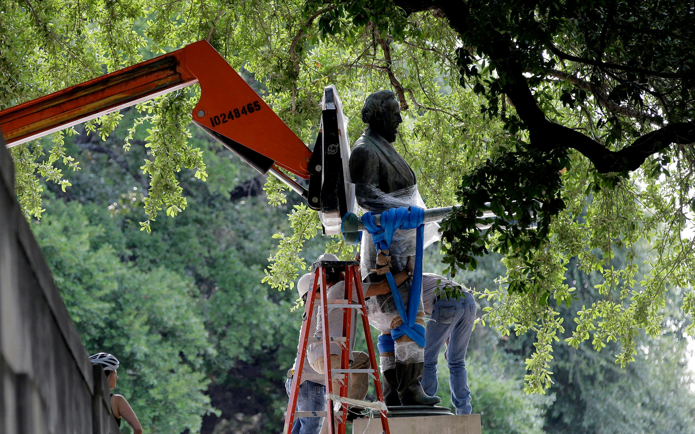 A statue of Confederate president Jefferson Davis being removed from the South Mall at the University of Texas at Austin