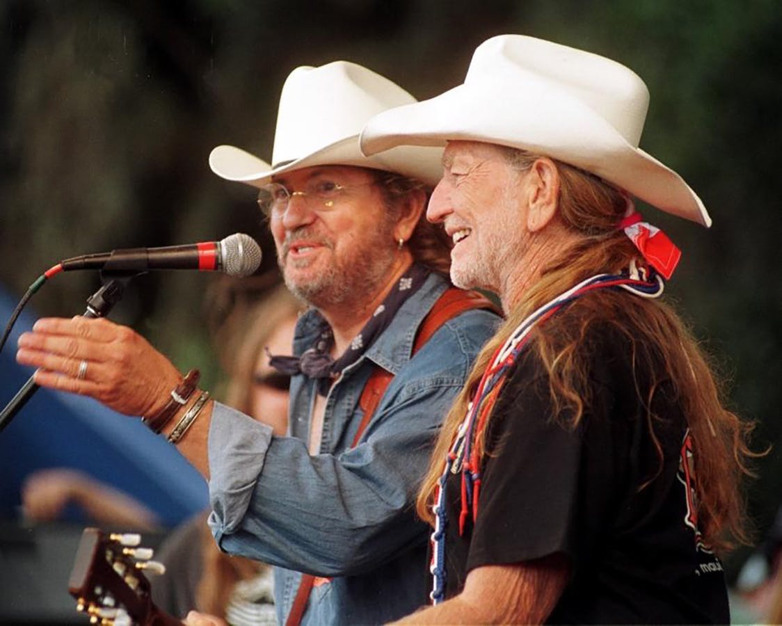 Ray Wylie Hubbard on stage with Willie Nelson.