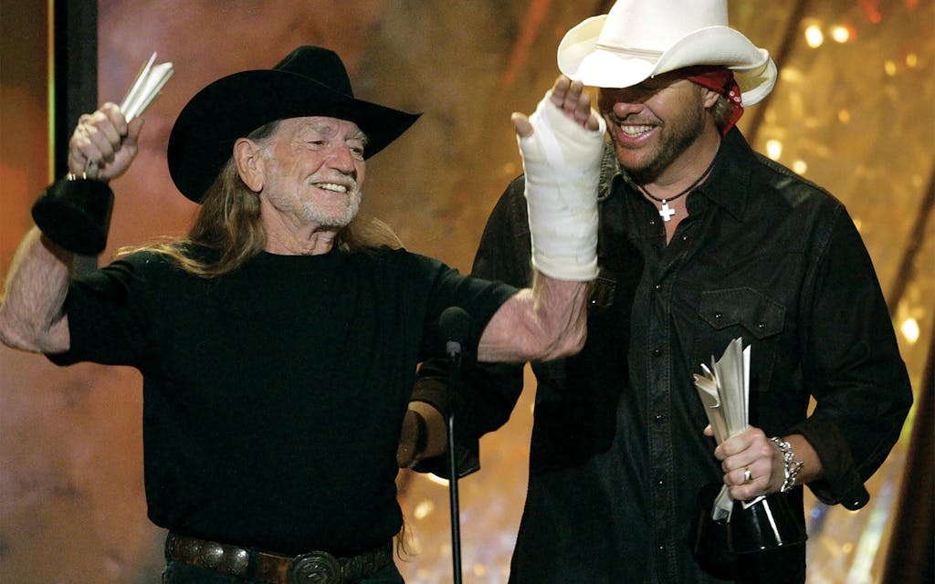 Willie and Toby Keith accept the video of the year award for their song "Beer for my Horses" at the 39th annual Academy of Country Music Awards in Las Vegas on May 26, 2004.