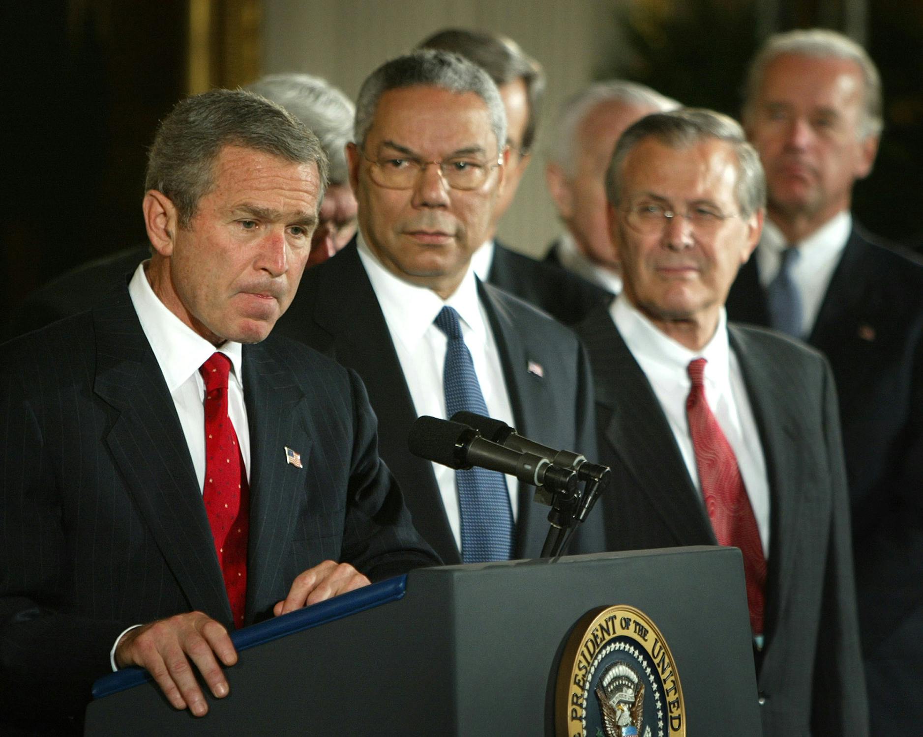 President Bush with Colin Powell and Donald Rumsfeld speak about authorizing the use of force against Iraq