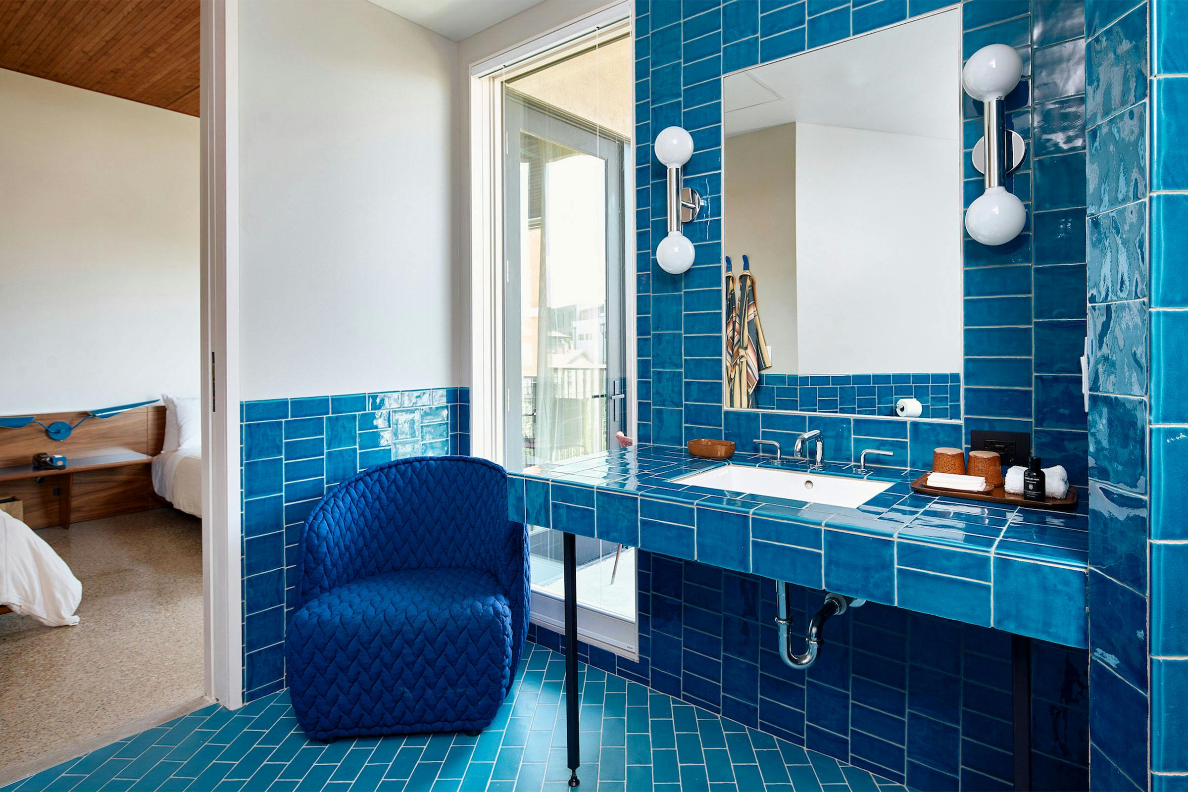 Blue-tiled bathroom in one of Hotel Magdalena's guest rooms. 