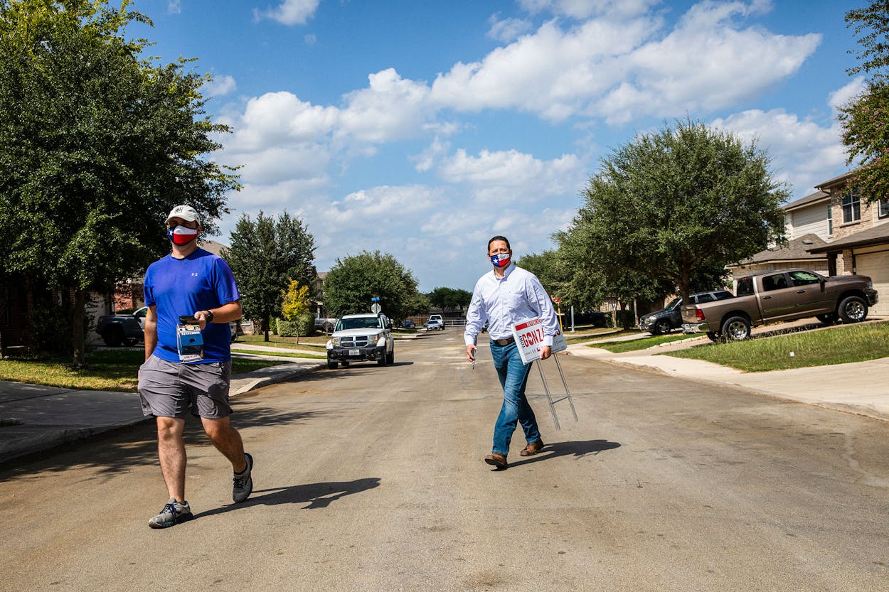 Republican congressional candidate Tony Gonzales (right) and his campaign manager, Michael Blair, going door-to-door in San Antonio in September.