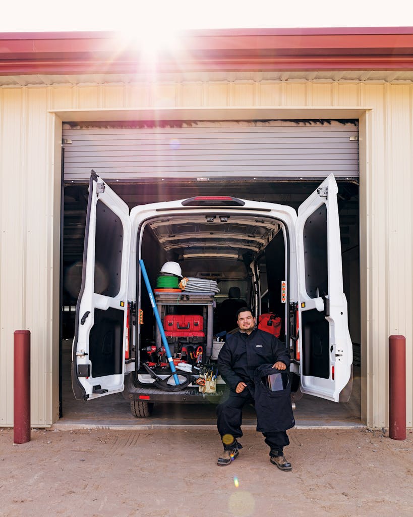 Angel Avila with the truck he works out of as an electrician, in El Paso on September 21, 2020.