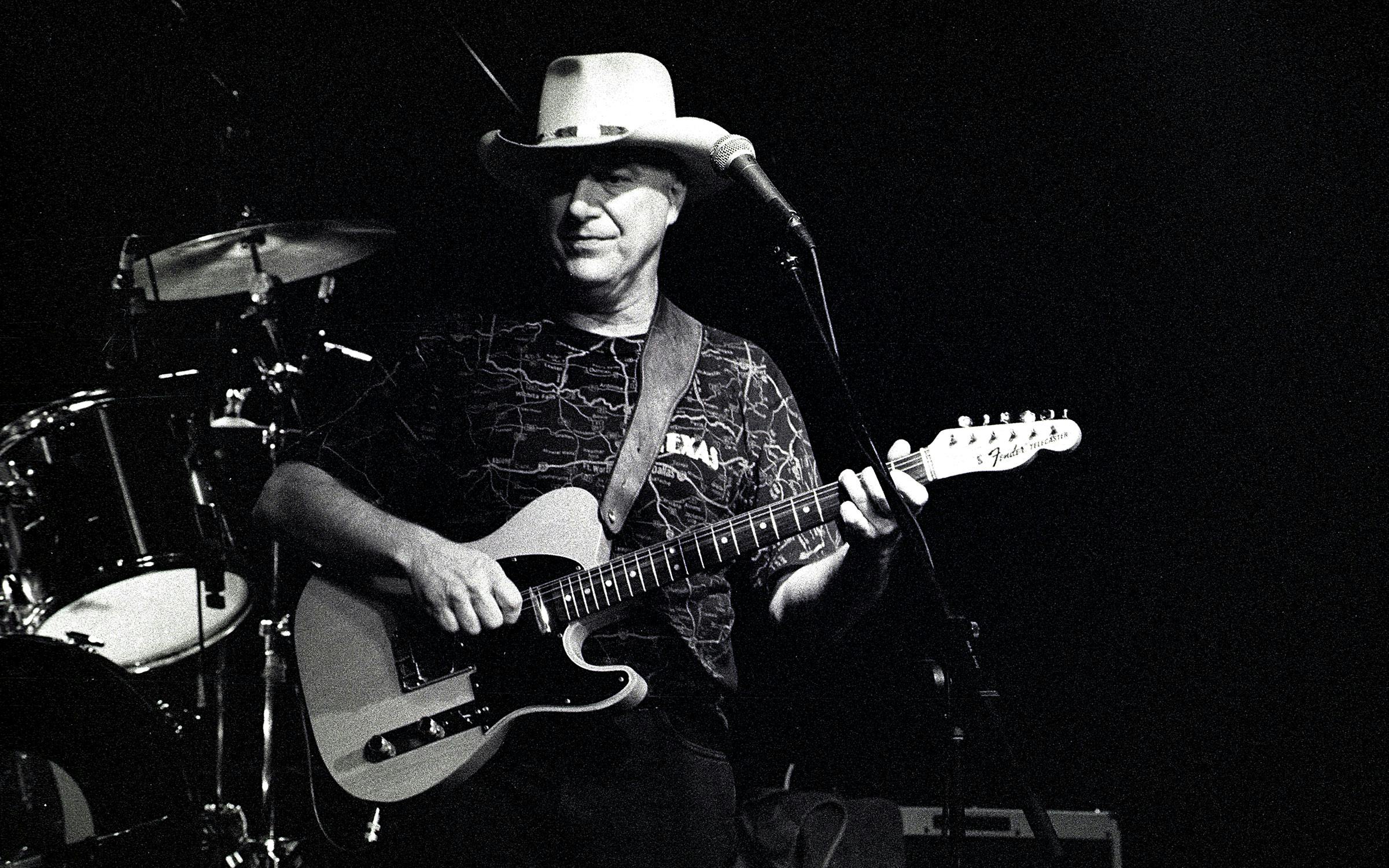 Jerry Jeff Walker performing on stage at the Fineline Music Cafe. 