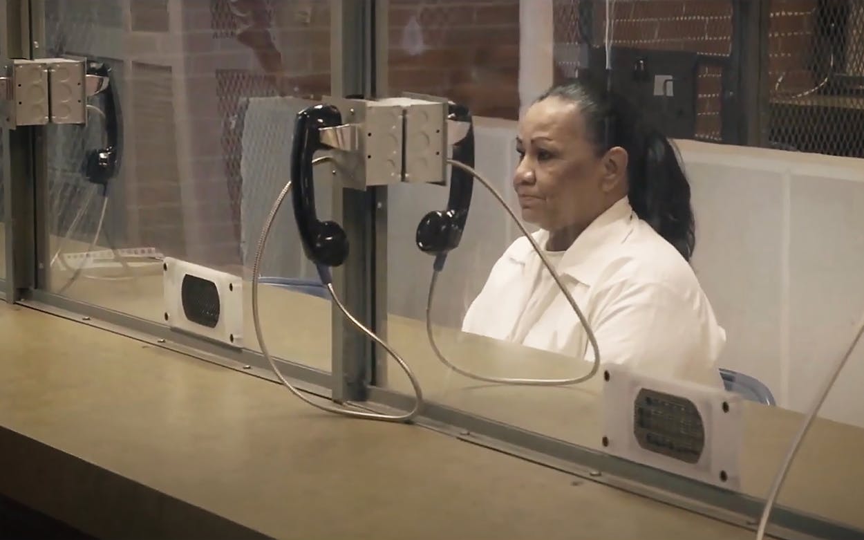 Melissa Lucio, the first Hispanic woman on death row and subject of the documentary 'The State of Texas vs. Melissa,' behind the glass barrier in prison.
