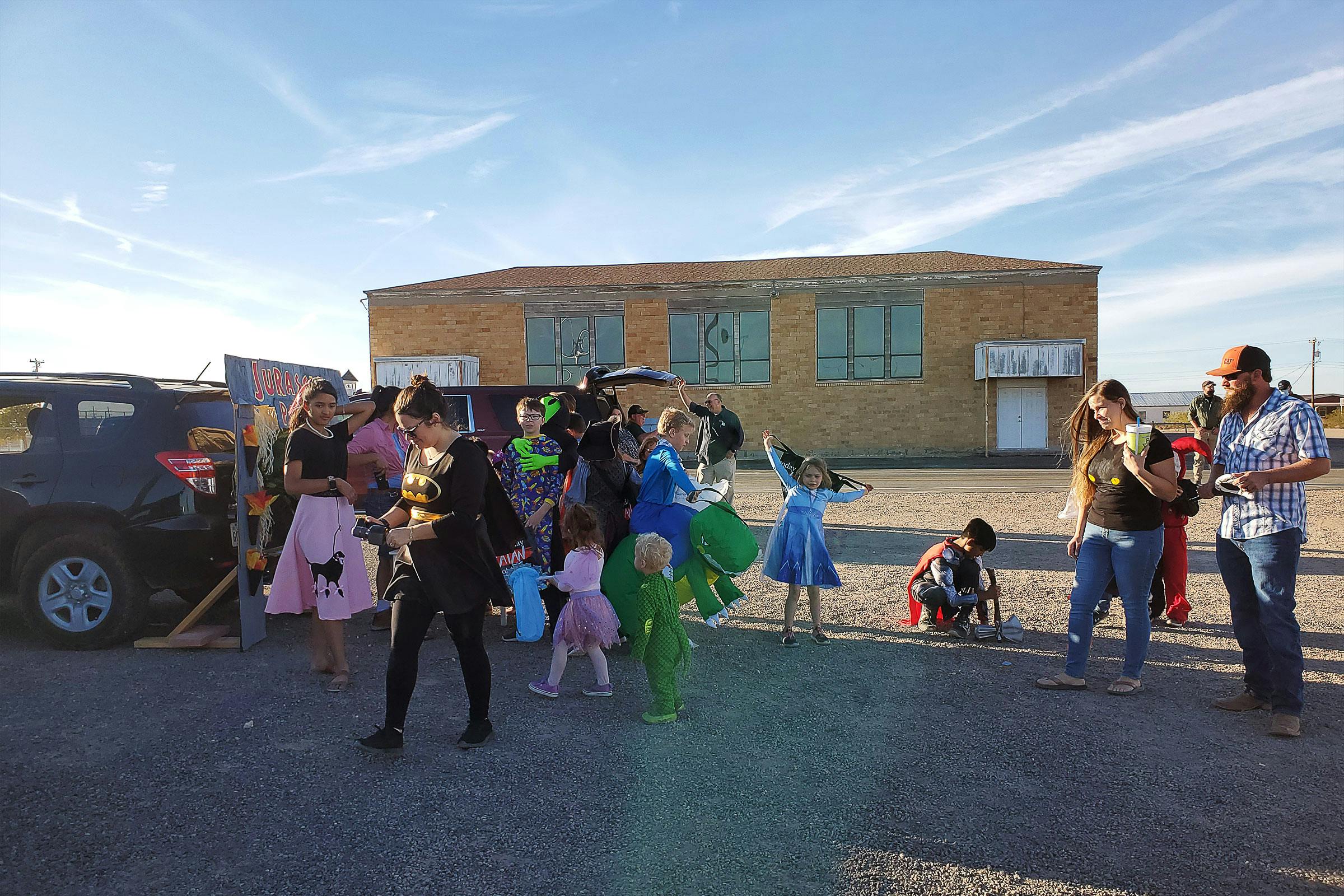 Parents and children dressed up for Halloween. 