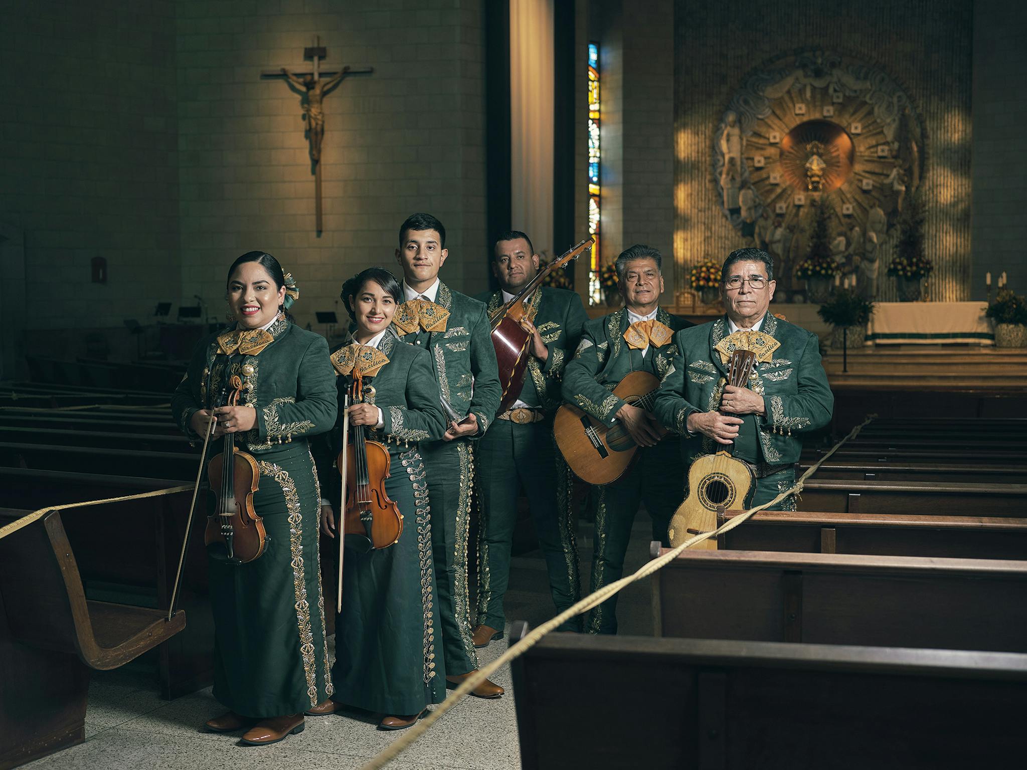Mariachi choir members Cecilia Chavez, Ana Tirado, Victor Fortuna, Genero Fortuna, Francisco Morales, and Arturo Hernandez with their instruments at the Basilica of Our Lady of San Juan del Valle in San Juan on October 18, 2020.