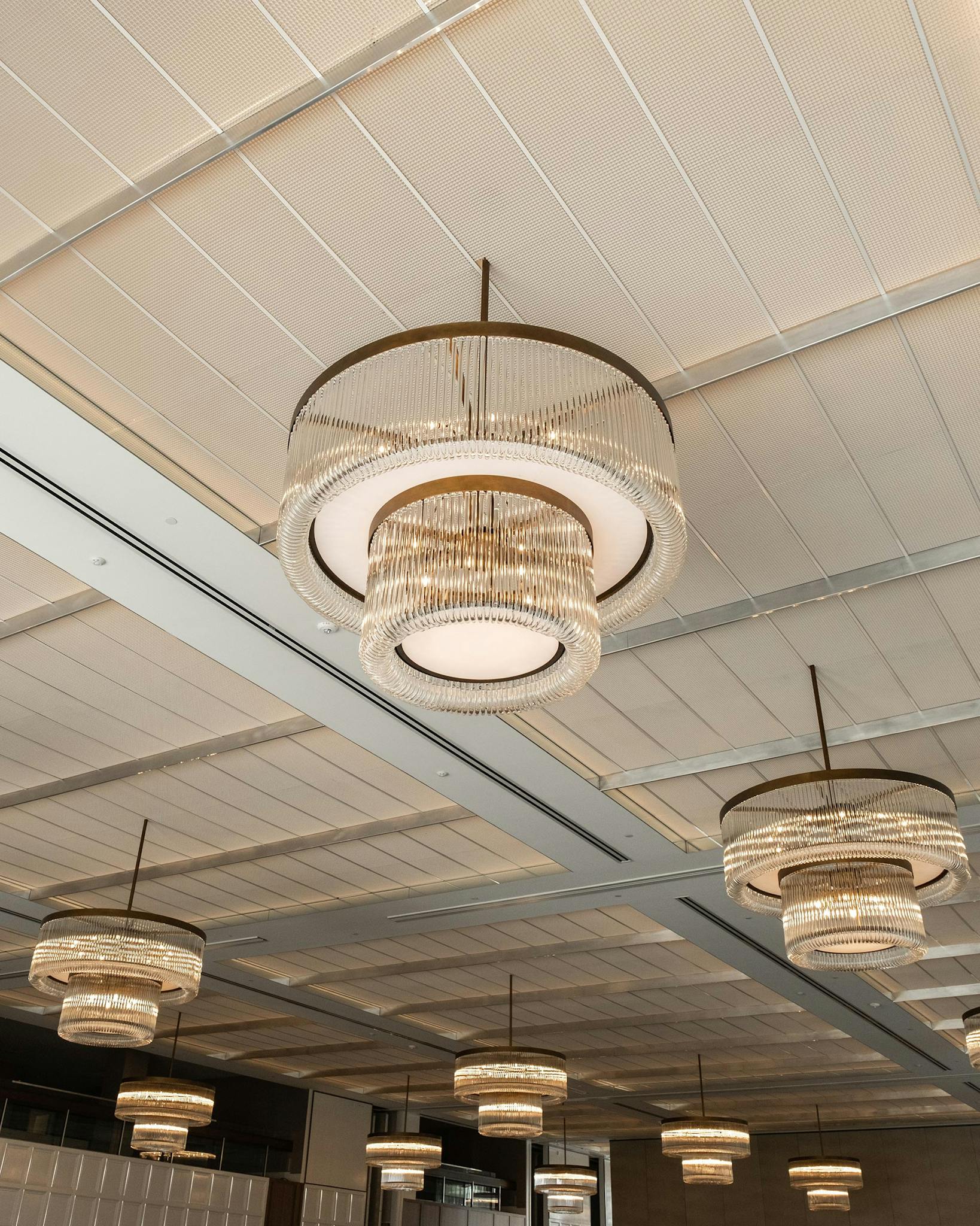 The ceiling of the Thompson Hotel with modern light fixtures.