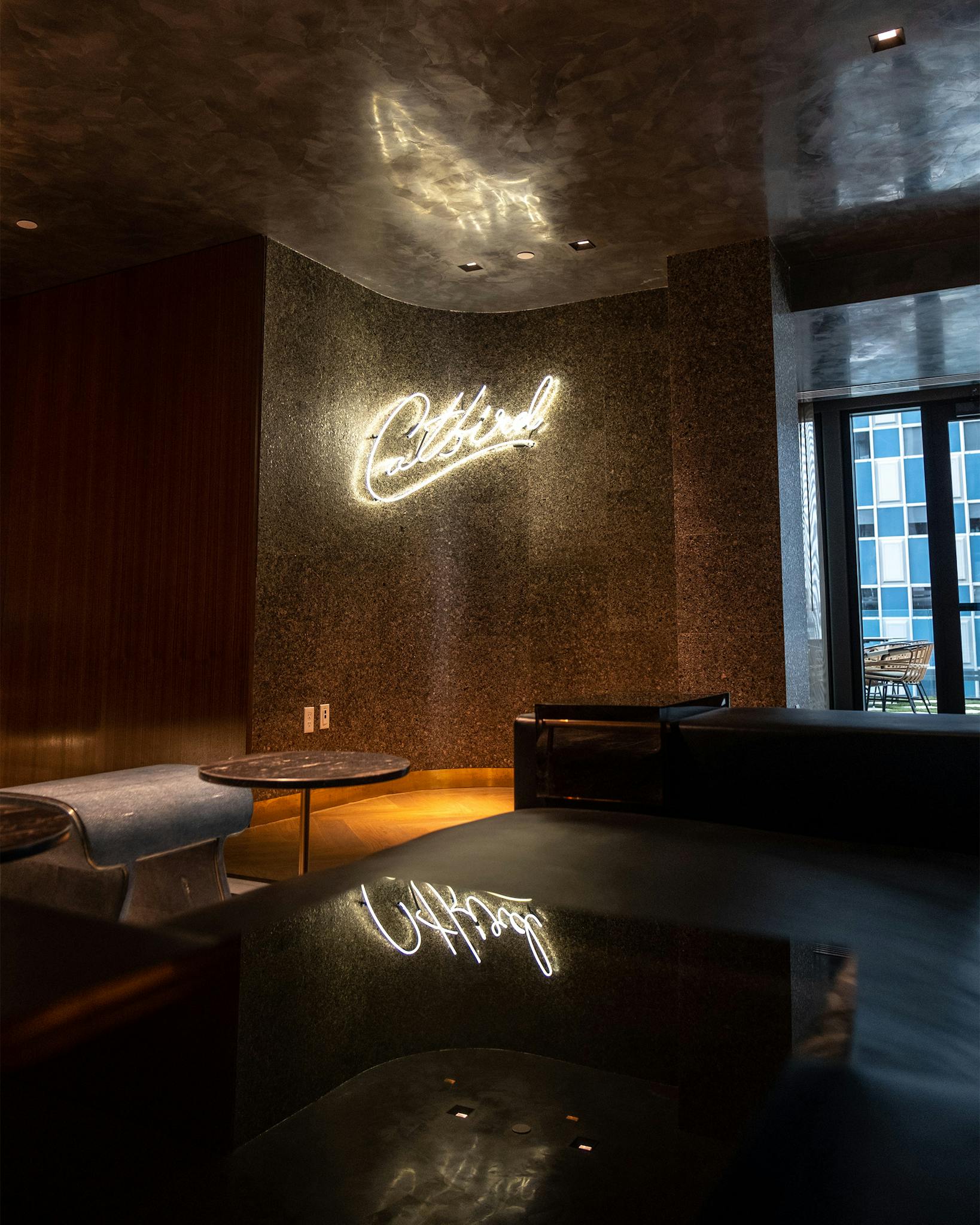 Catbird's light up sign and seating in the Thompson Hotel.