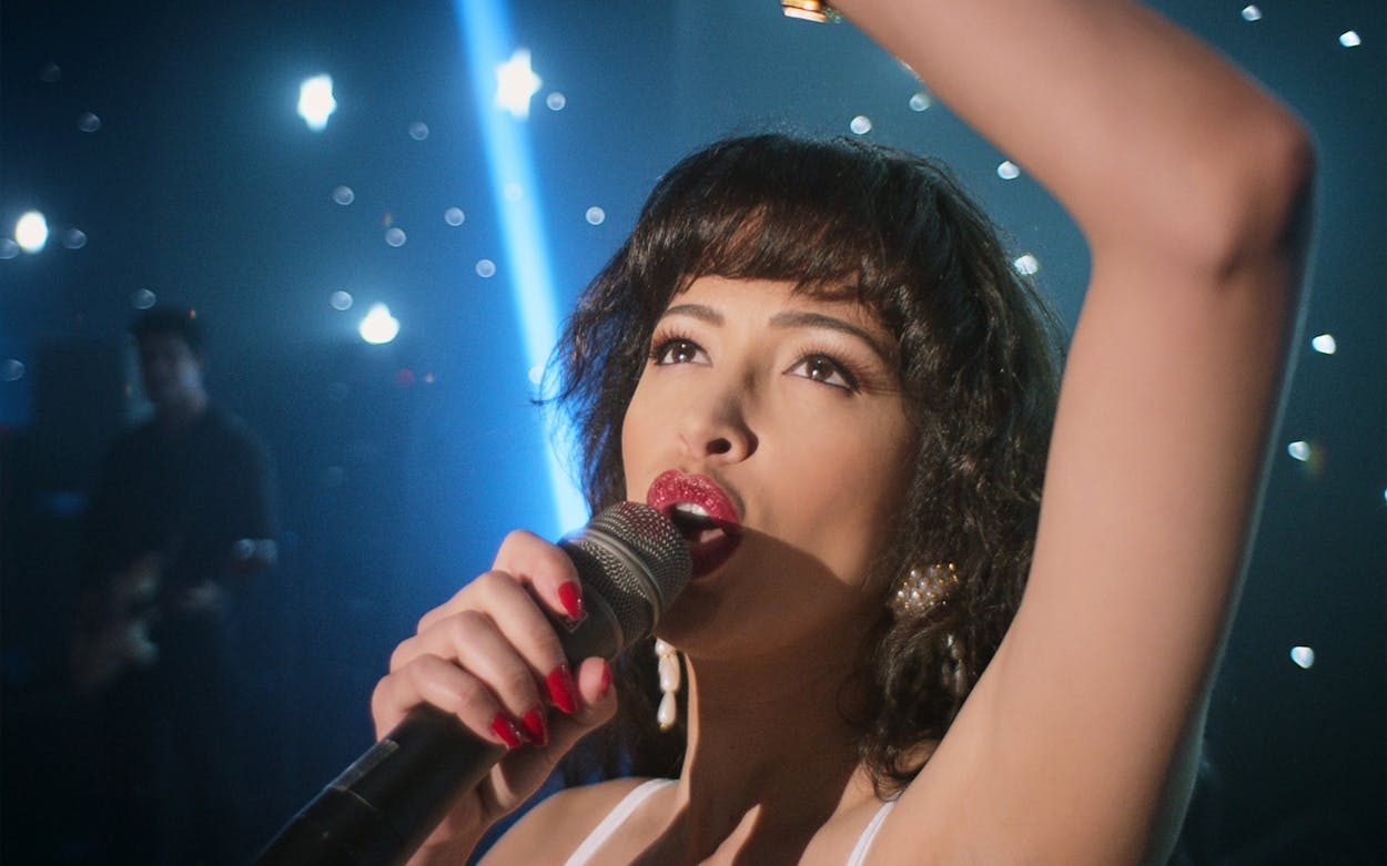 Christian Serratos as Selena Quintanilla performing on stage in Selena: The Series.