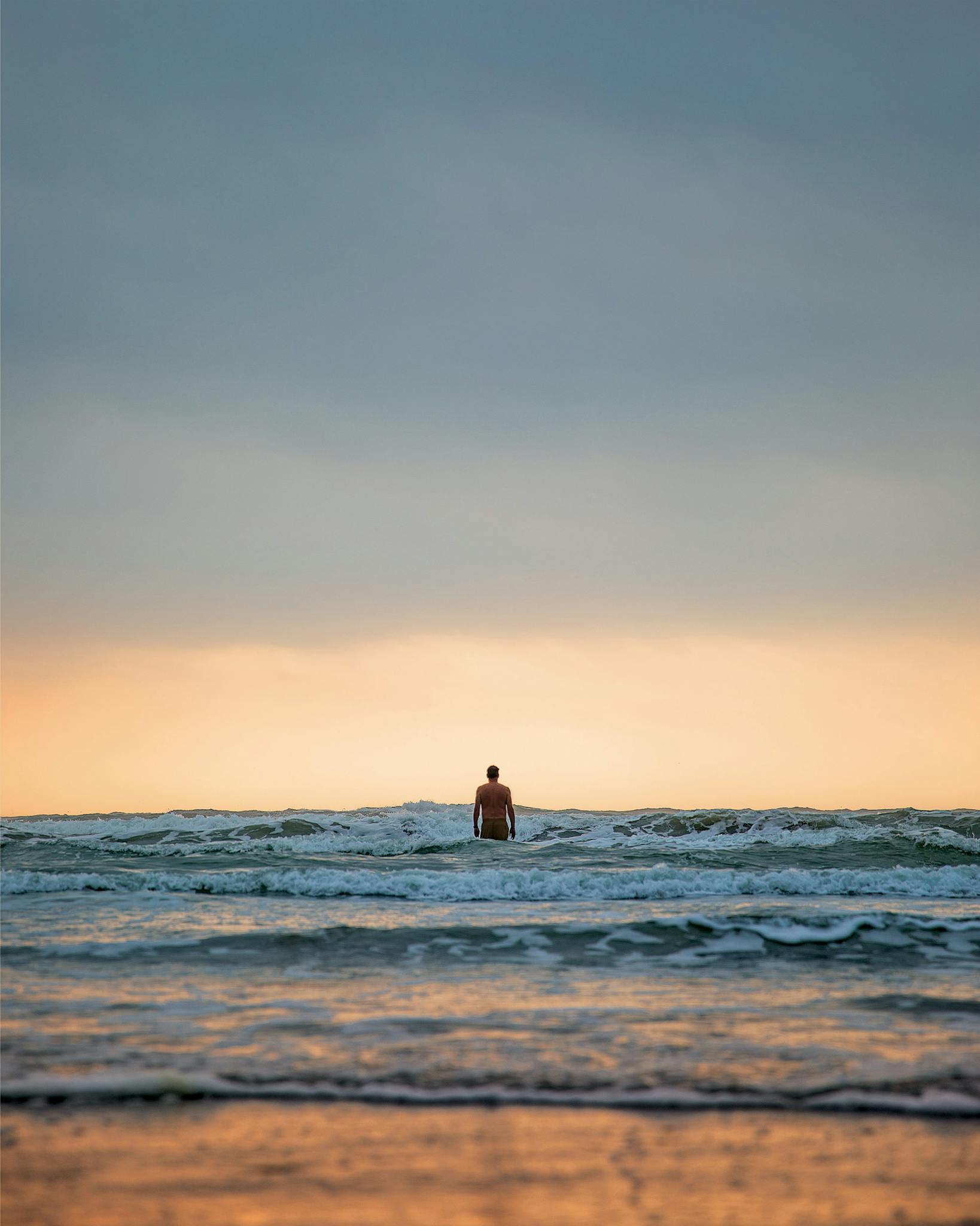 Writer David Courtney takes an early morning dip around mile marker 20 on Padre Island National Seashore on March 24, 2020.