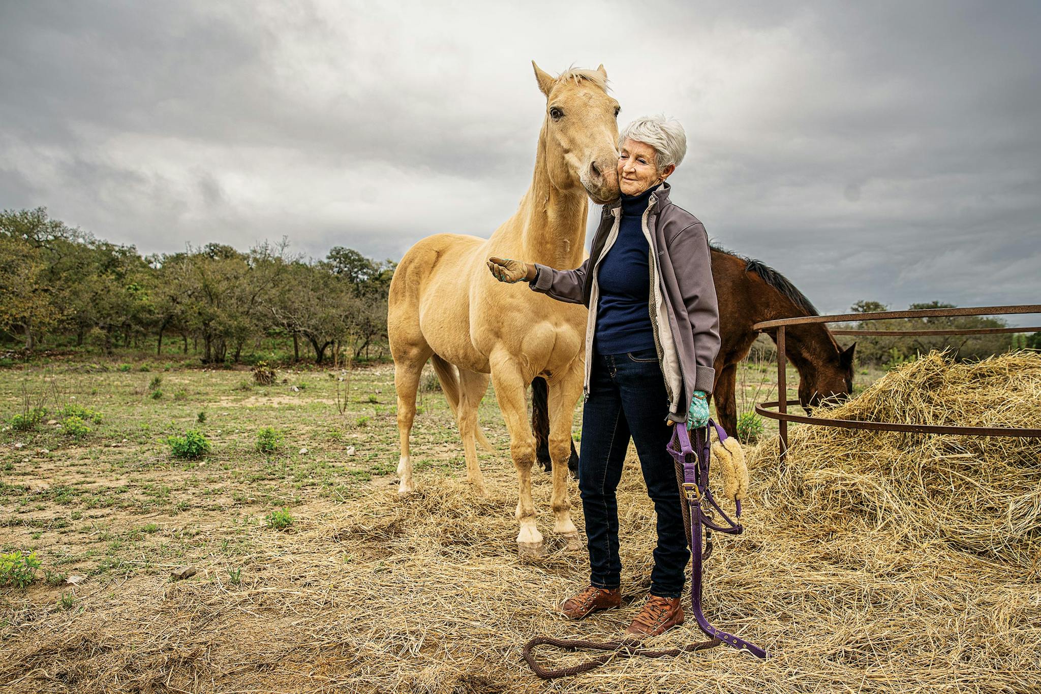 Paulette Jiles with her horses at her home, in Utopia, on March 20, 2020.