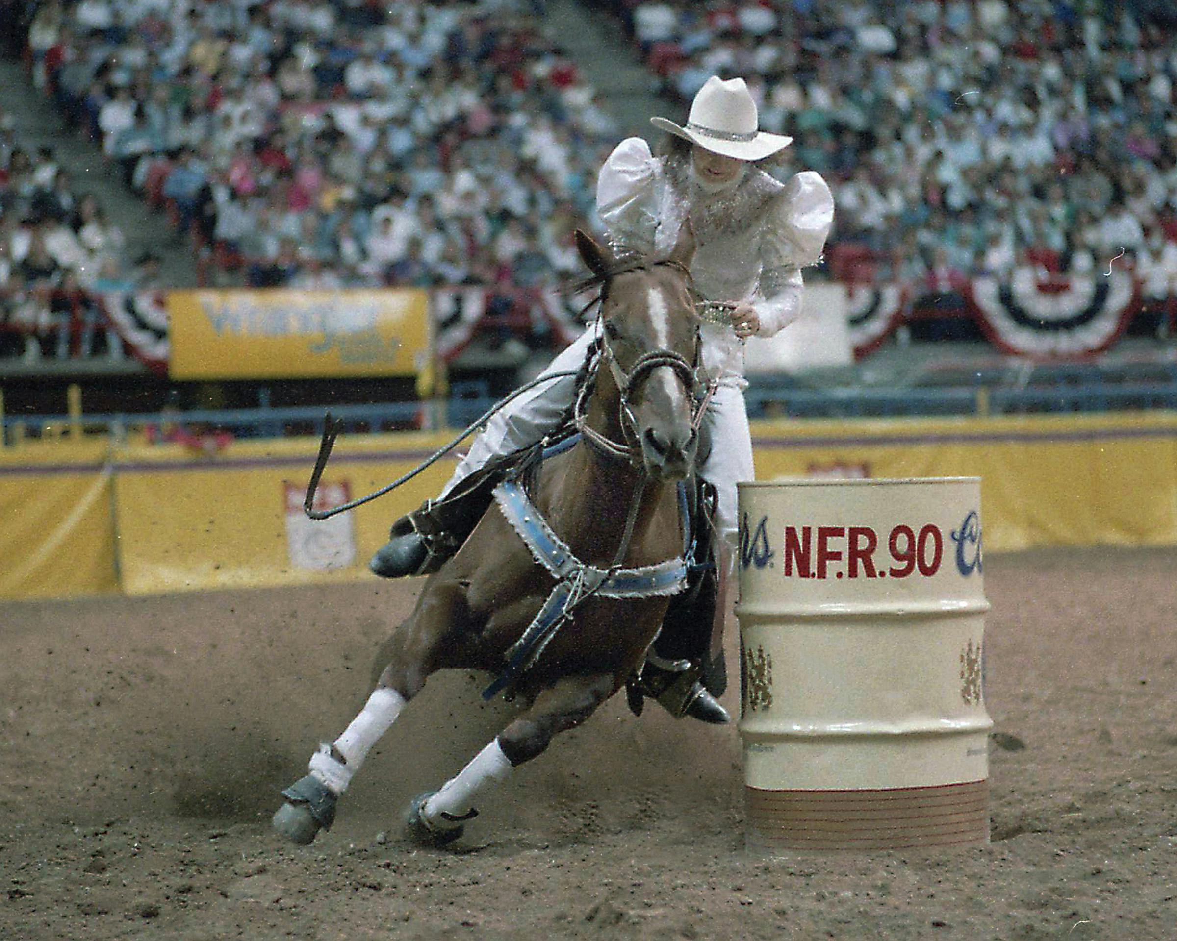 Martha competing in the outfit she had fashioned out of a wedding dress, at the 1990 National Finals Rodeo.