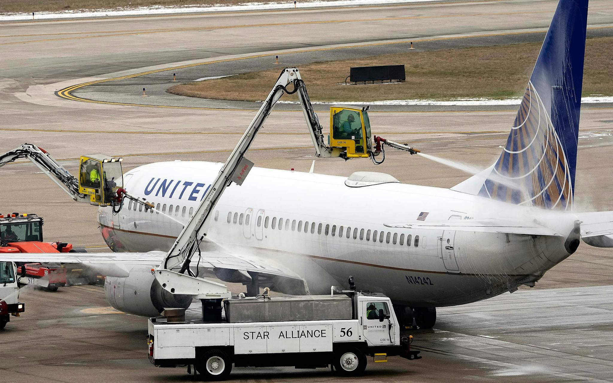 Deicing an airplane at the George Bush Intercontinental Airport during the 2021 Texas snow storm.