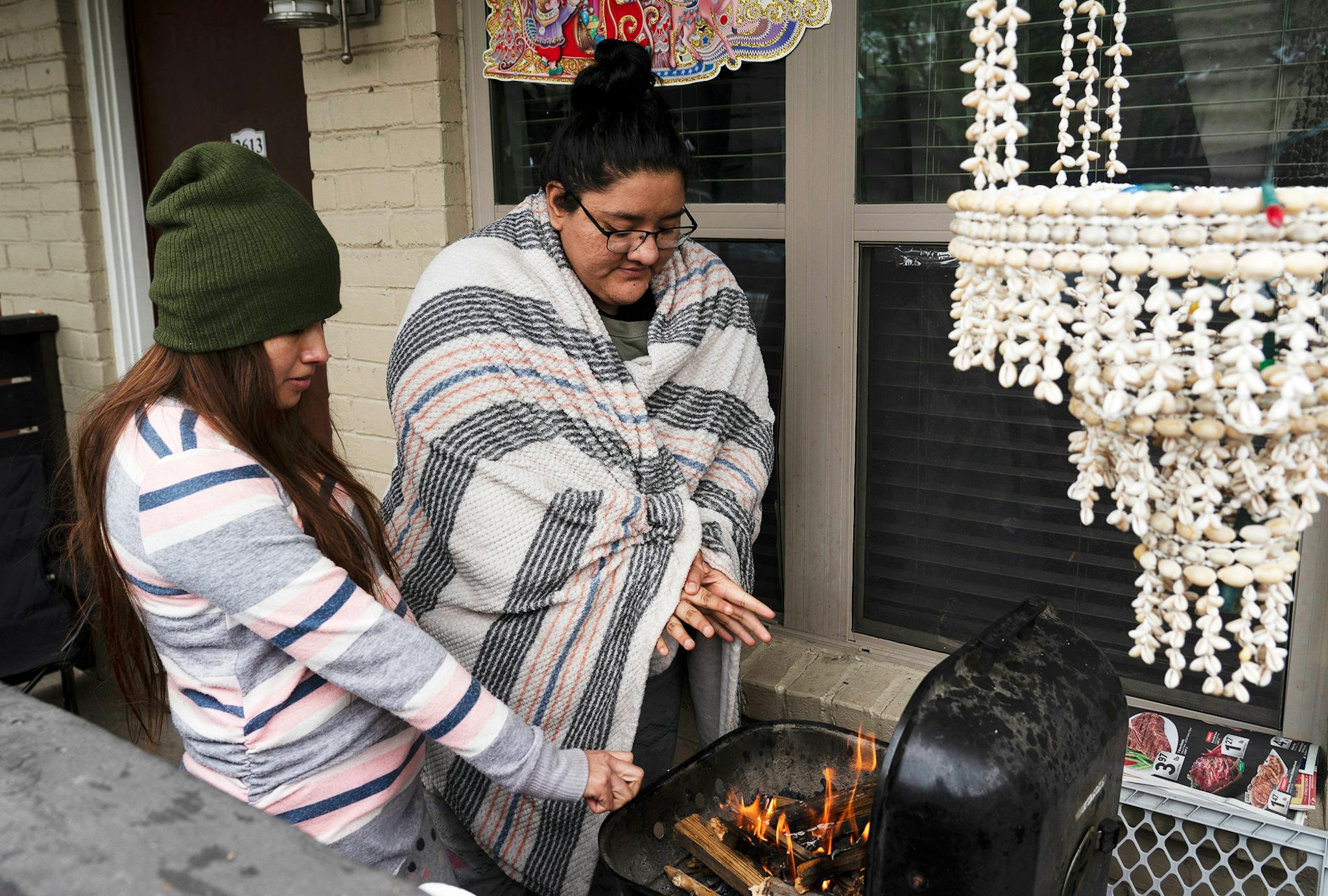 Texans using a BBQ grill as an emergency heat source during the 2021 Texas snow storm.