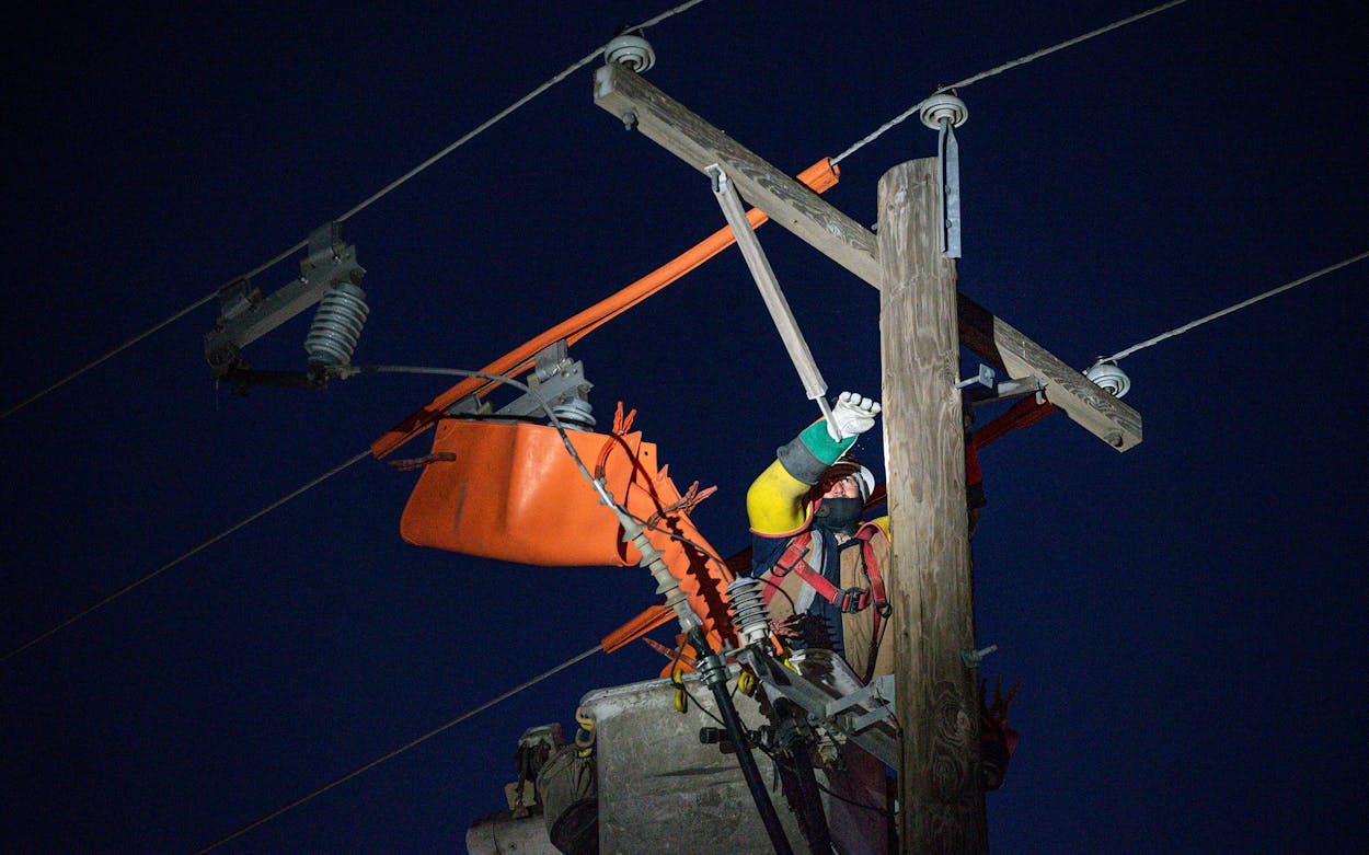 Oncor apprentice lineman Brendan Waldon repairs a utility pole that was damaged by the winter storm that passed through Texas Thursday, Feb. 18, 2021, in Odessa.