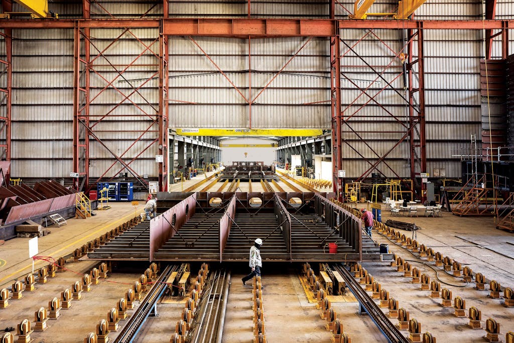 A sub-block of the Charybdis moving down a portion of the Keppel AmFELS assembly line known as the “panel line,” where the steel is ground and components such as pipes are installed on the vessel.
