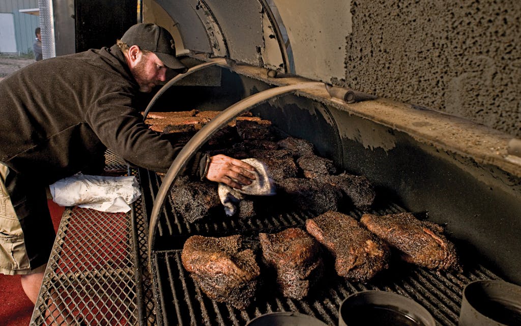John Mueller, tending his meat.