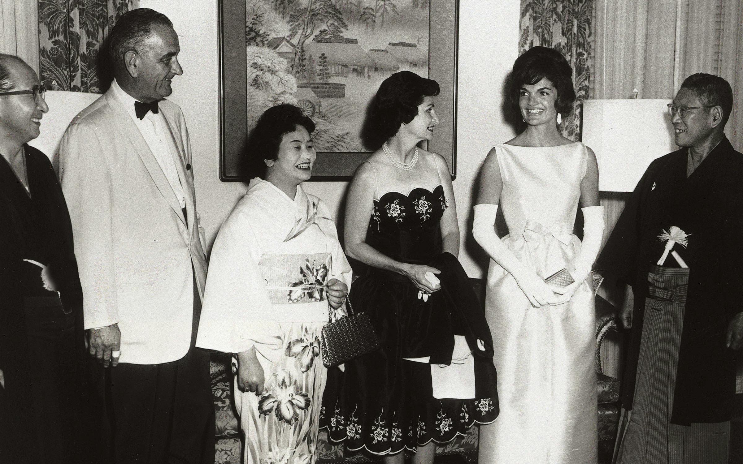 Lady Bird Johnson with Lyndon B. Johnson and Jacqueline Kennedy at a National Guard Armory dinner. 