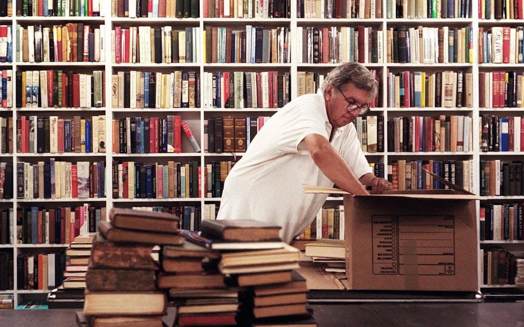 larry mcmurtry surrounded by books in his bookstore in archer texas