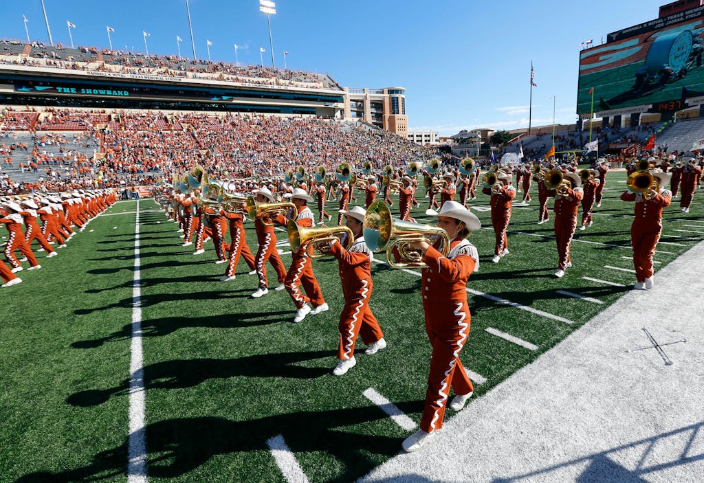 The University of Texas Longhorn Band performs before the NCAA Big 12 game between the Texas Longhorns and the West Virginia Mountaineers on November 8, 2014 at Darrell K. Royal-Texas Memorial Stadium in Austin.