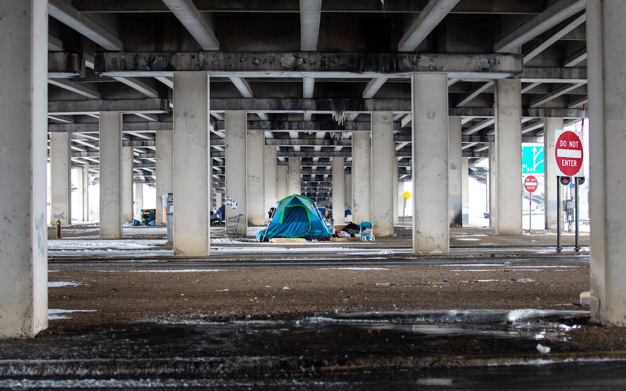 A homeless camp under a bridge on I-35 in Austin, Texas