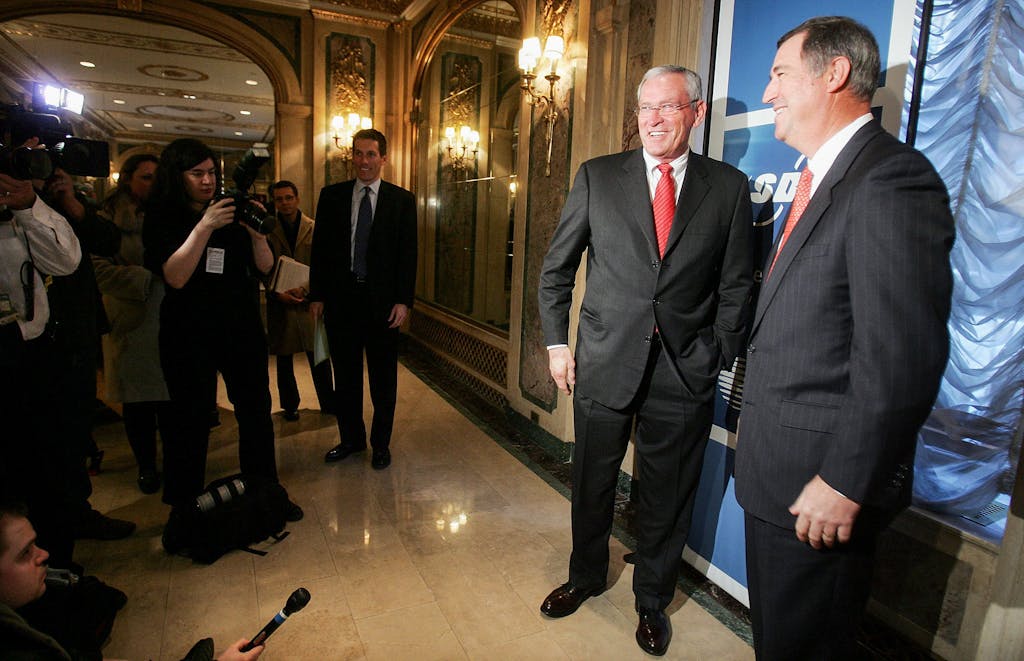 David W. Dorman, AT&T chairman and chief executive (right) and Ed Whitacre, CEO of SBC pose for a photograph in the Plaza Hotel February 1, 2005 in New York City.