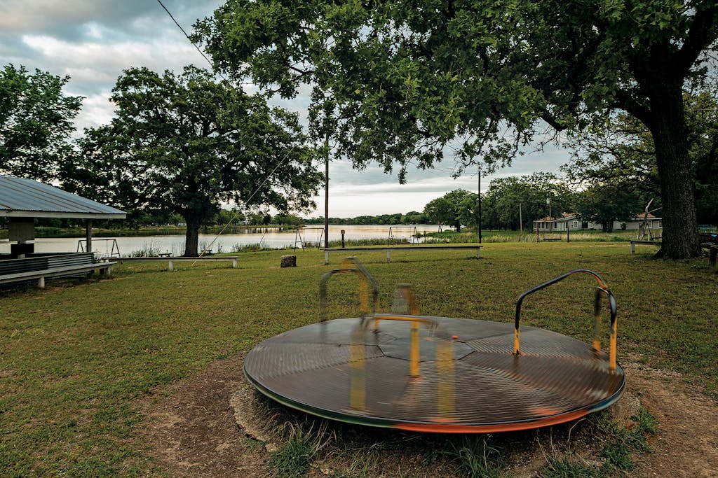 Merry-go-round in front of Lake Mexia. 