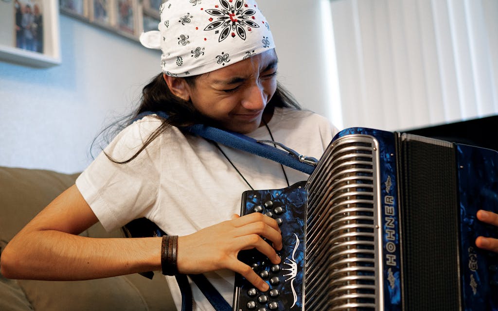 Christopher Ramirez practices accordion at his home in San Antonio on May 5, 2021.