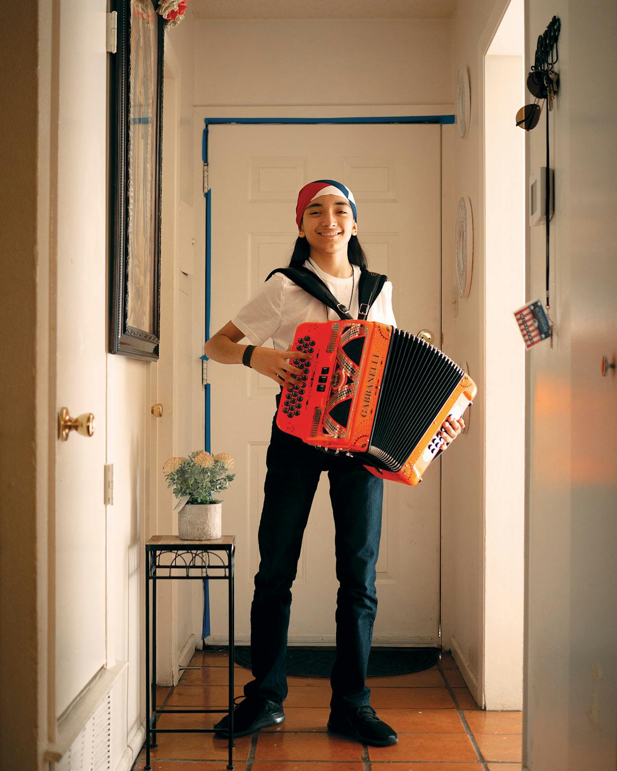 Christopher Ramirez with his accordion at his home on May 5, 2021.