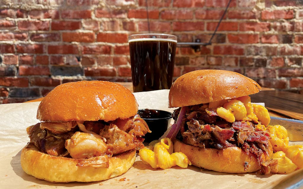 The smoked jackfruit (left) and MacRib sandwiches and a brown ale at Intrinsic Smokehouse and Brewery, in Garland.